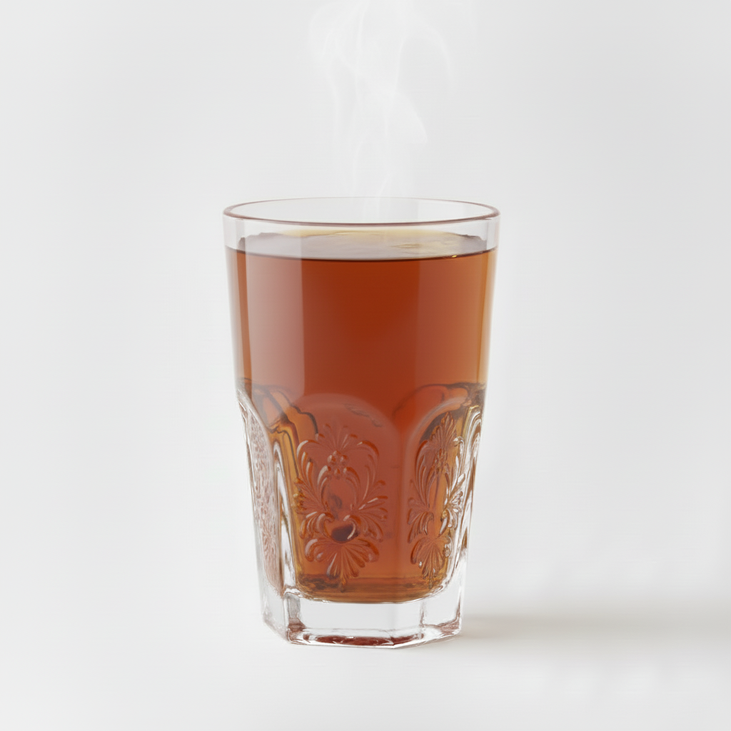Black tea in decorative glass with white background