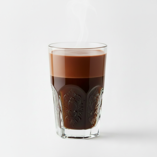 Hot chocolate in decorative glass with white background